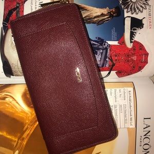 Tumi Zip around Burgundy Wallet Sinclair *New*